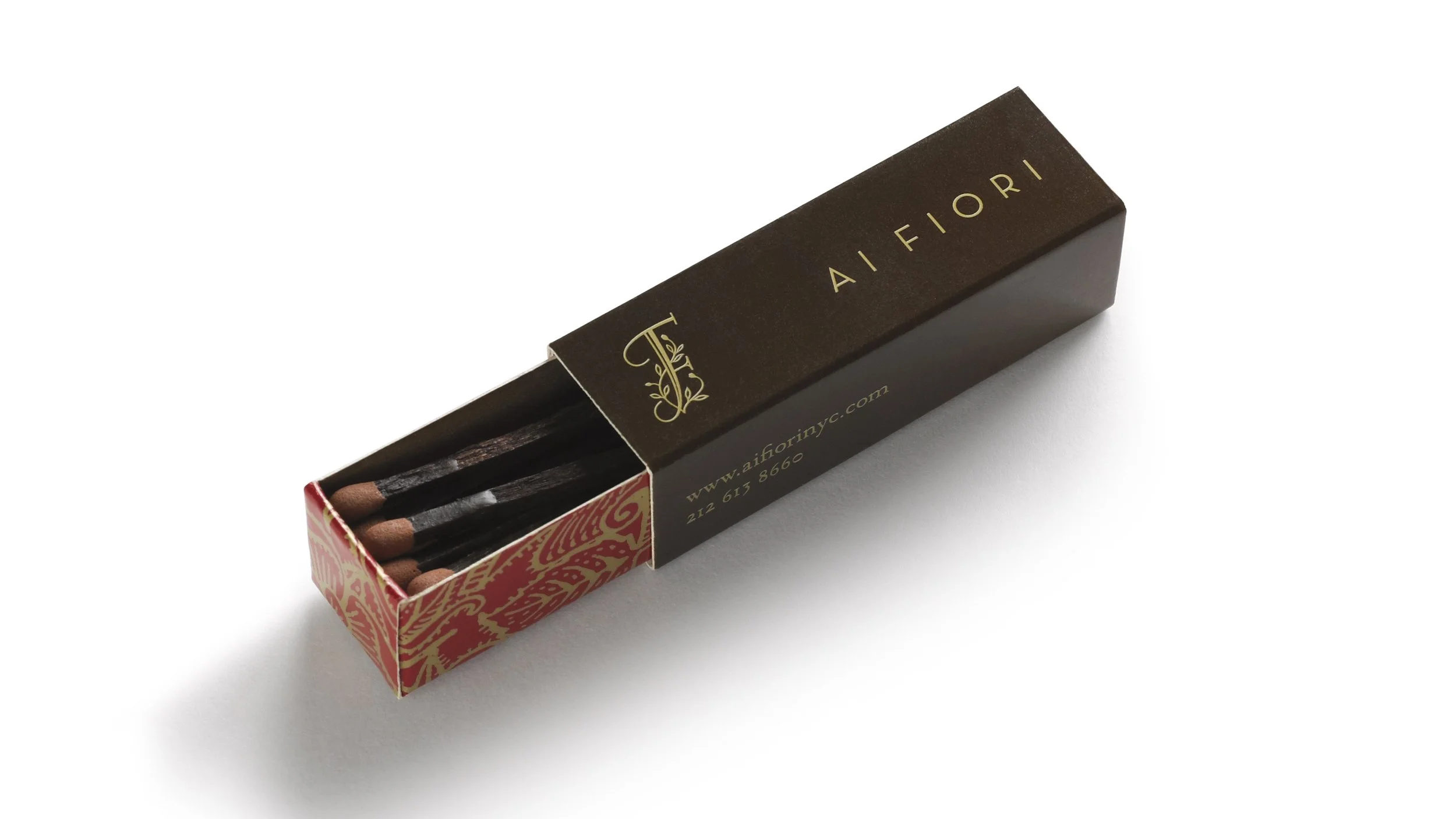 Ai Fiori matchbox with a brown branded sleeve and red-and-gold patterned tray.