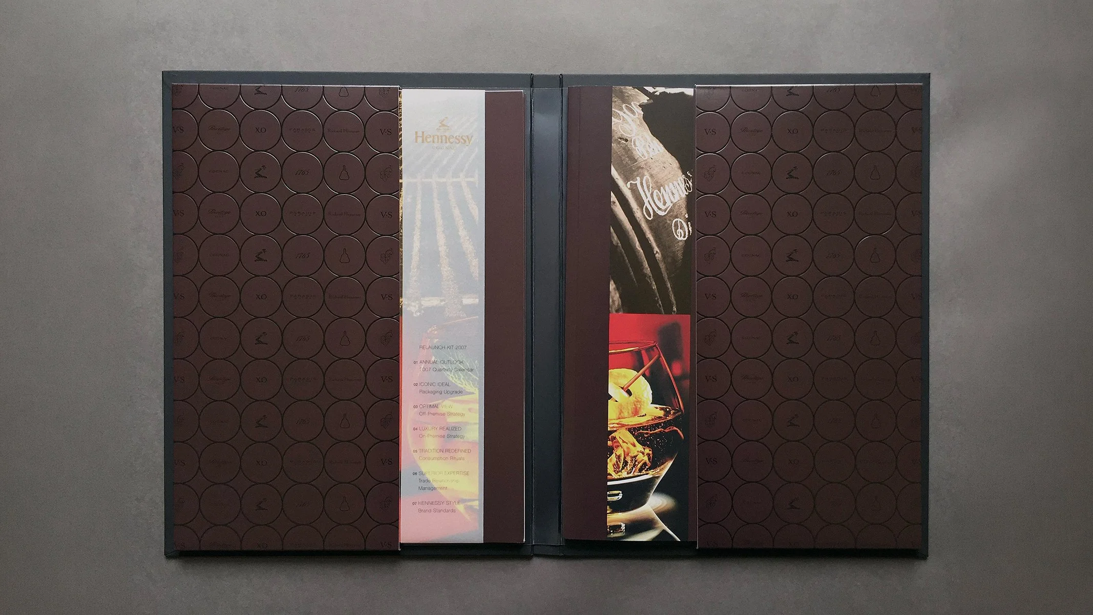 Hennessy brand book spread presenting luxury guidelines and imagery.