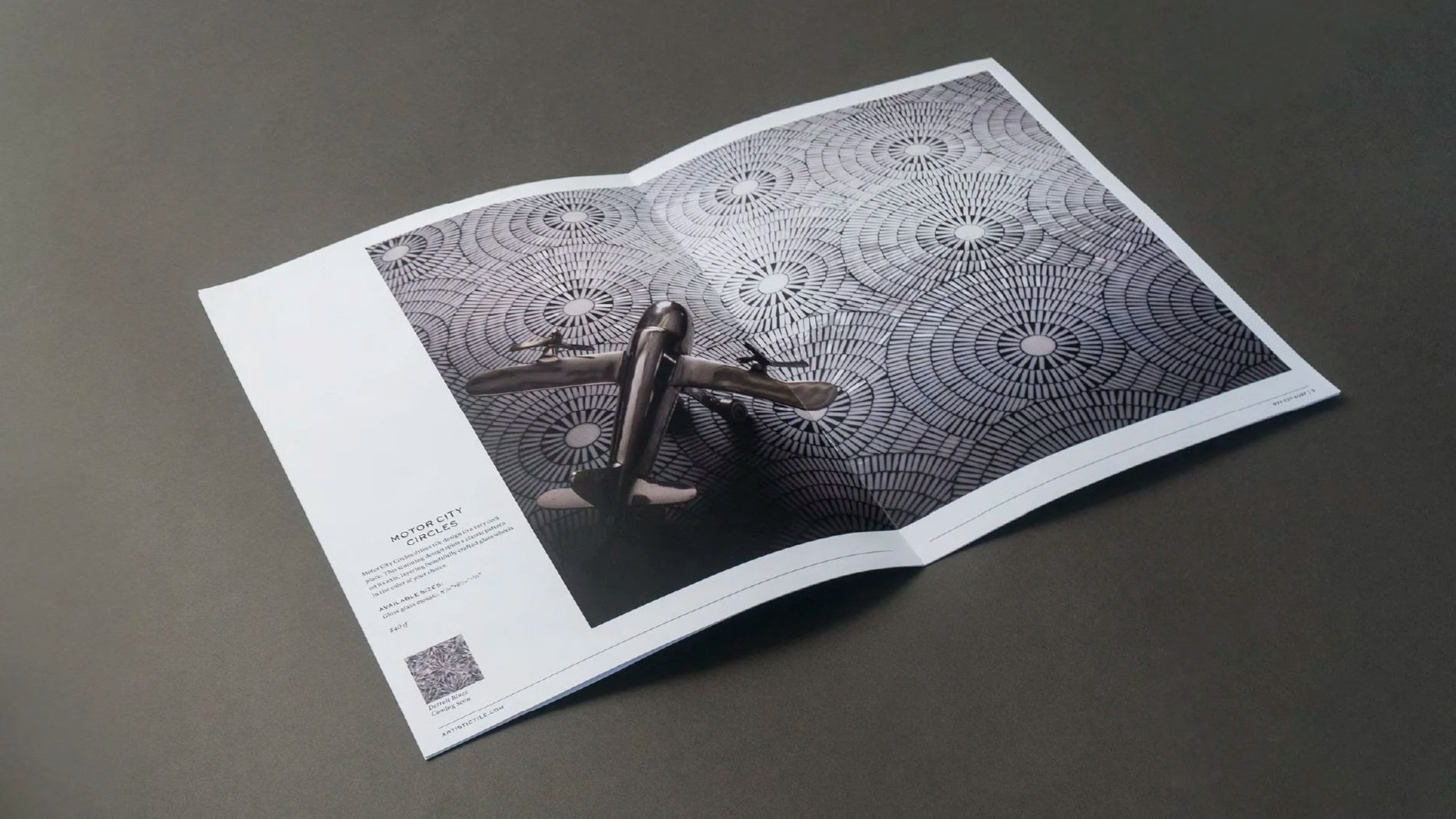 Artistic Tile brochure spread featuring a model airplane on a circular mosaic tile pattern.