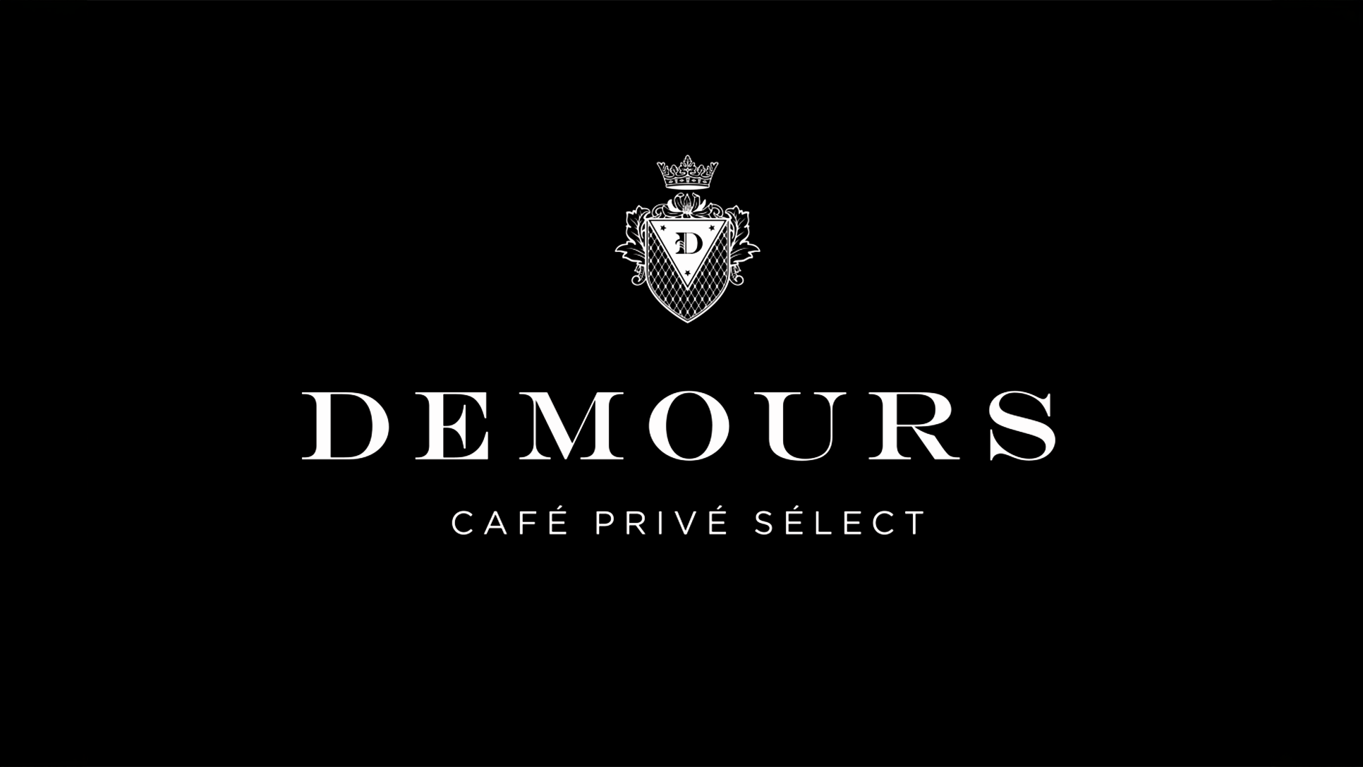 Demours Coffee wordmark presented on a black background.