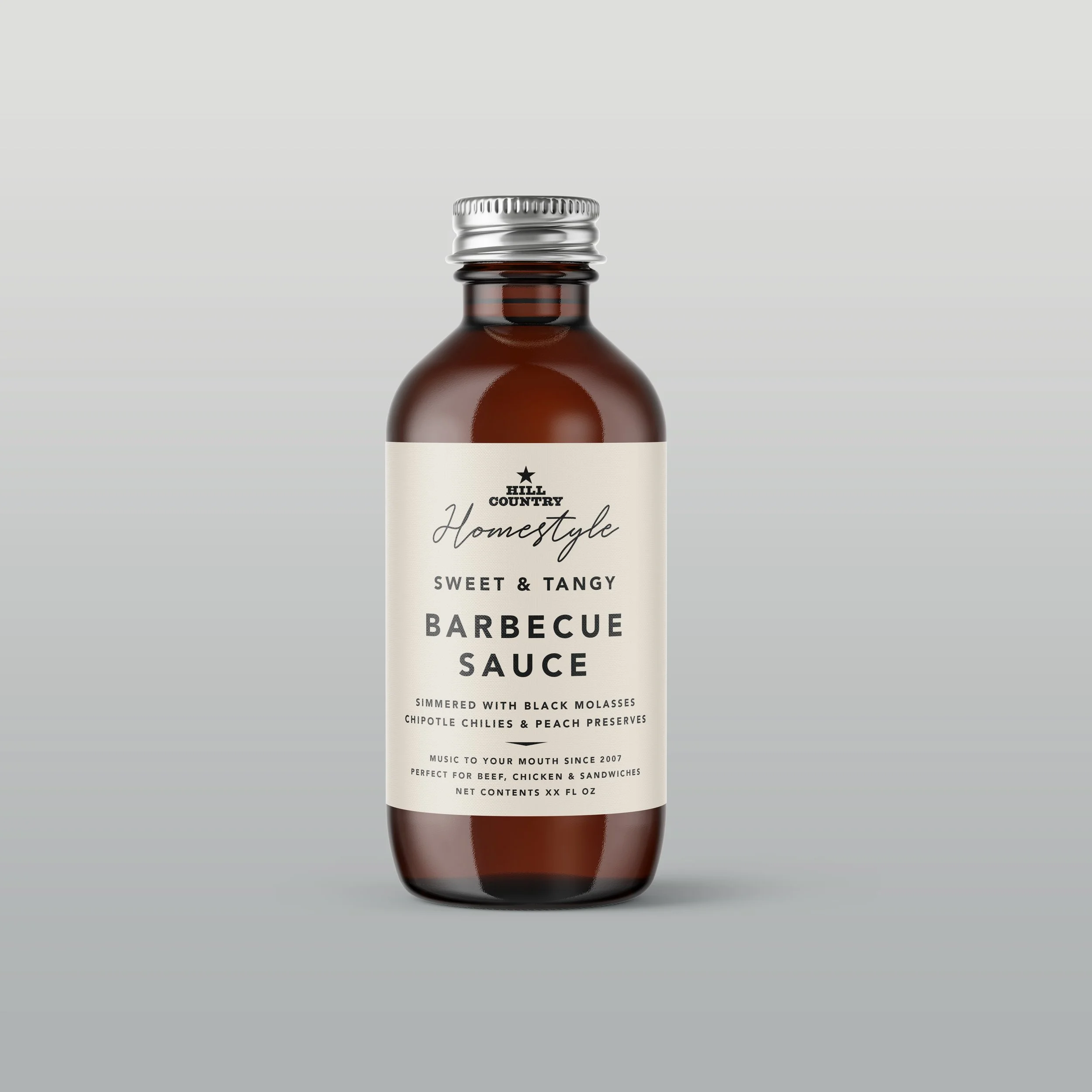 Hill Country Homestyle barbecue-sauce bottle concept with a cream label and silver cap.