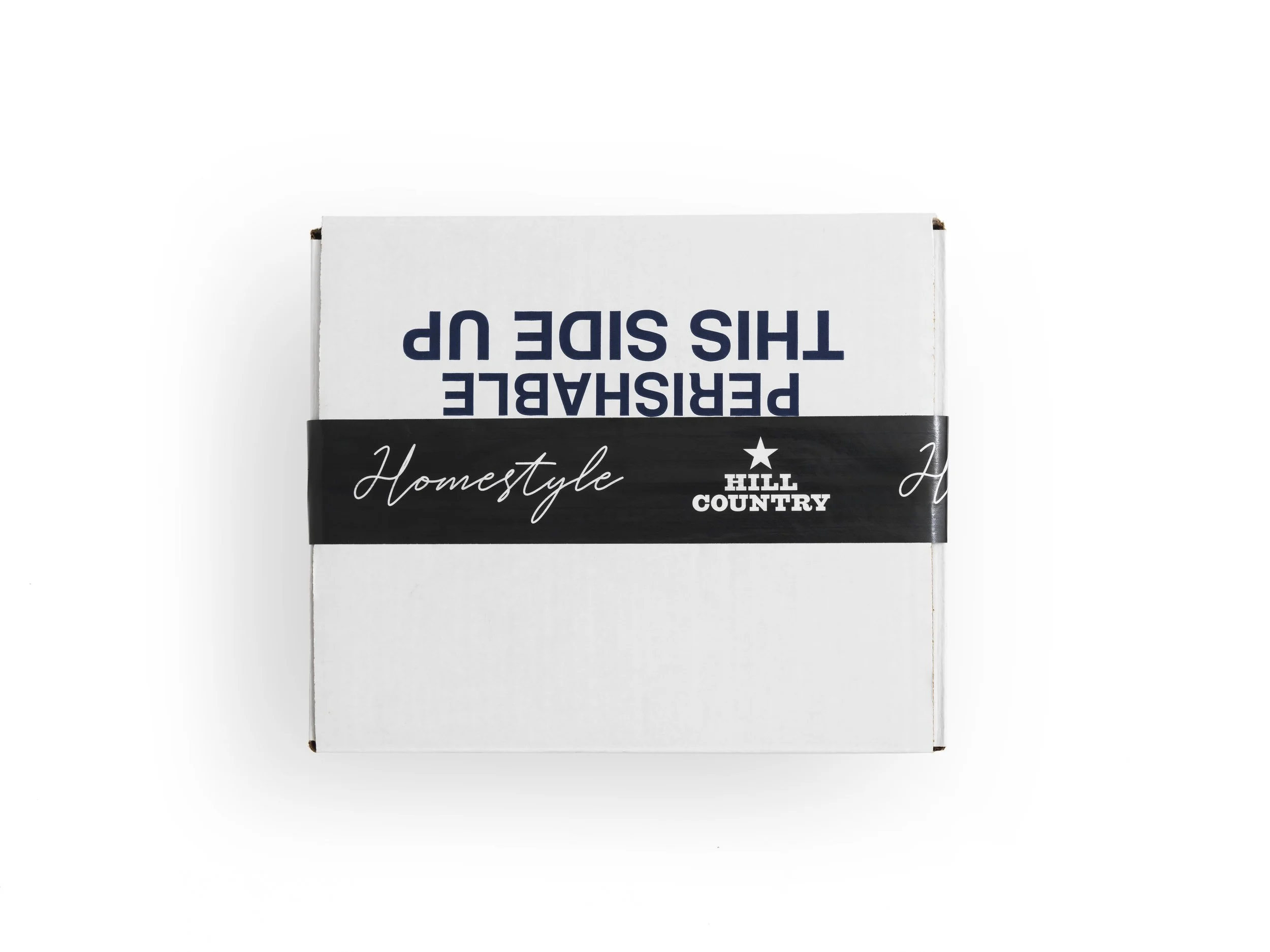 Closed Hill Country Homestyle insulated shipping box sealed with a black branded band.