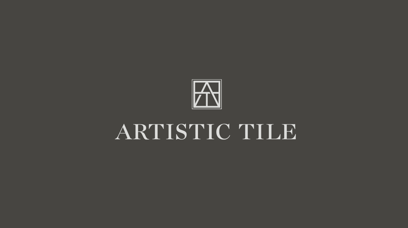 Artistic Tile wordmark and geometric AT monogram on a gray background.