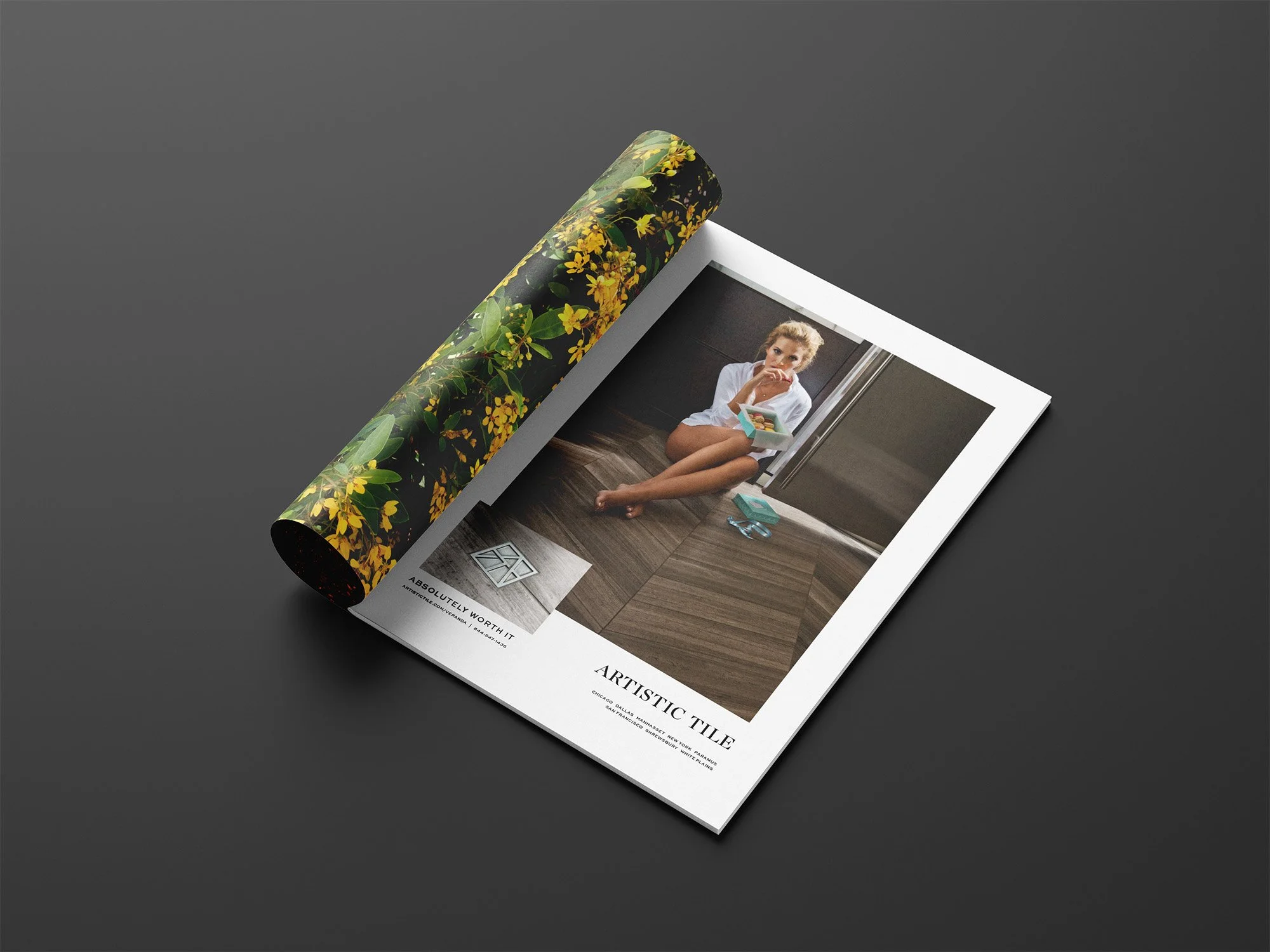 Artistic Tile magazine-ad mockup featuring the foyer campaign photograph and the Absolutely Worth It platform.