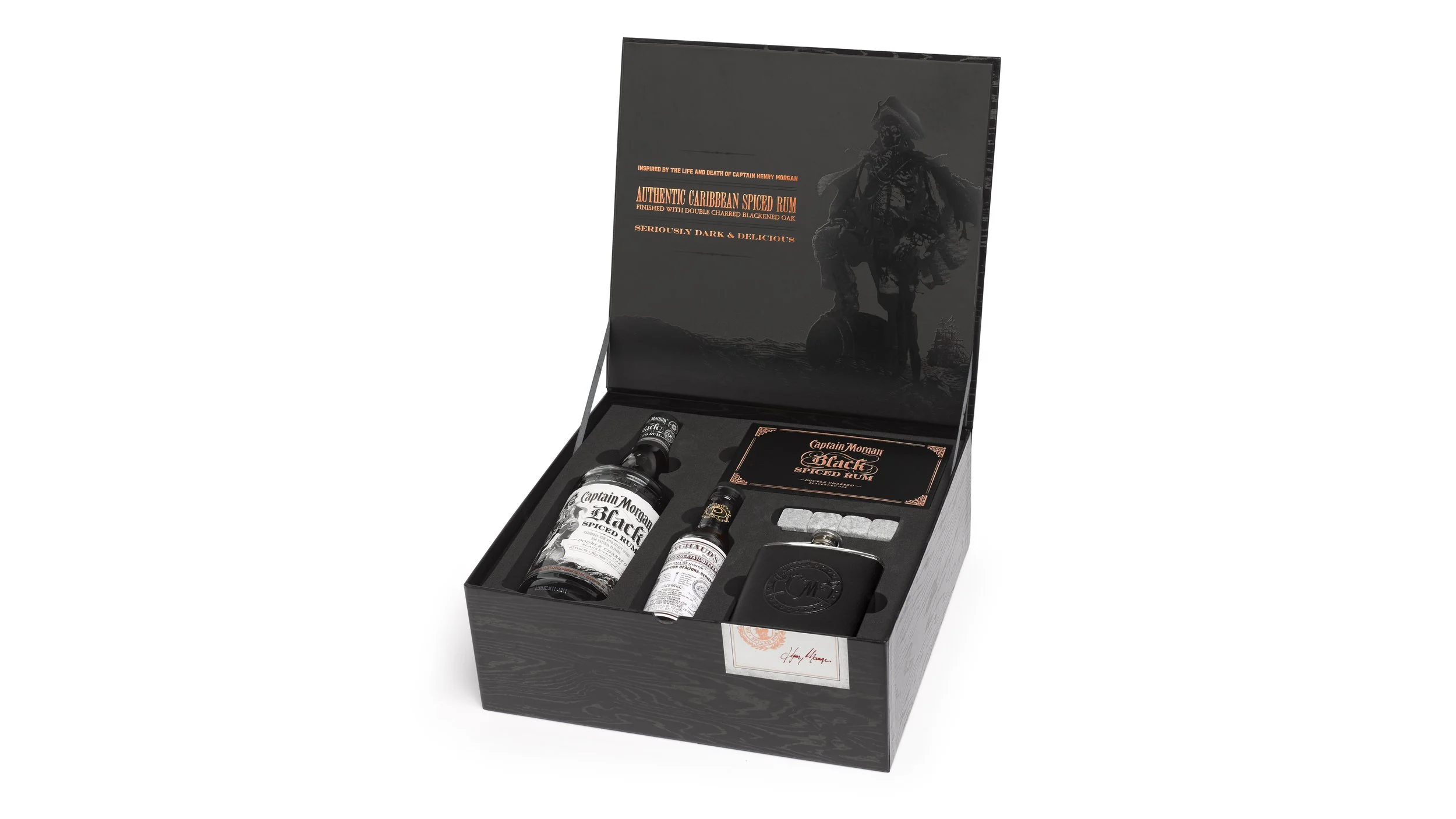 Open Captain Morgan Black trade kit with rum, bitters, a flask, chilling stones and a brand book.