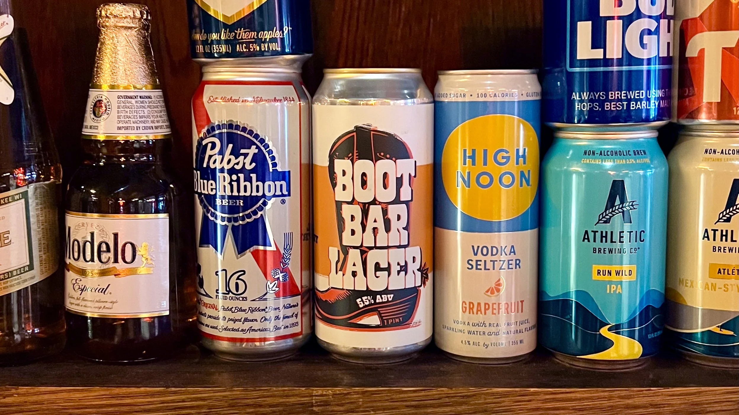 Boot Bar Lager can displayed on a shelf beside other beverage brands.