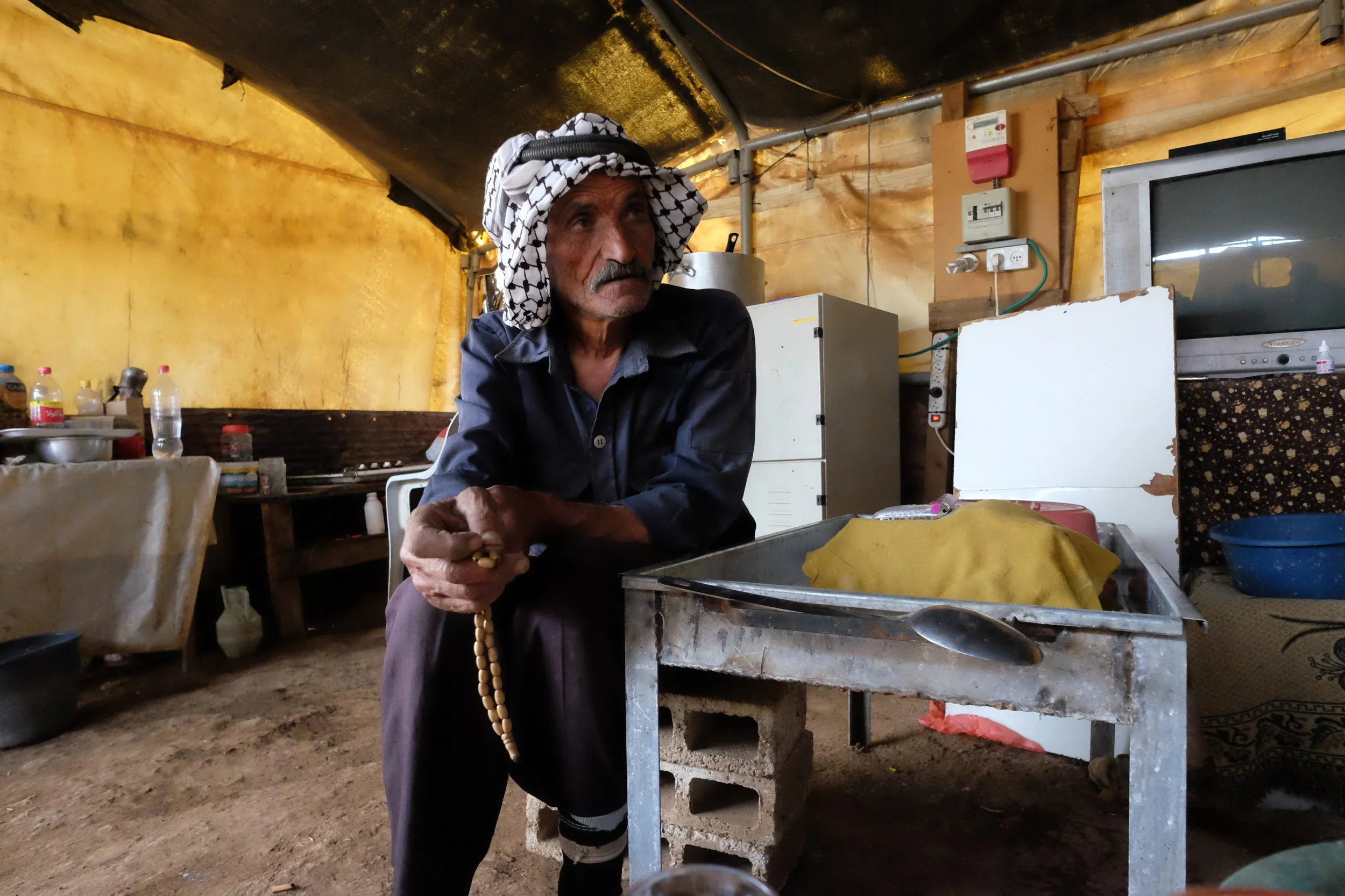 A Palestinian farmer and his wife in Al-Ras Al-Ahmar, in the Jordan Valley, share their experiences living in an area used for IDF training exercises. Their village is located nearby but they choose to live in tents to protect their herds which graze