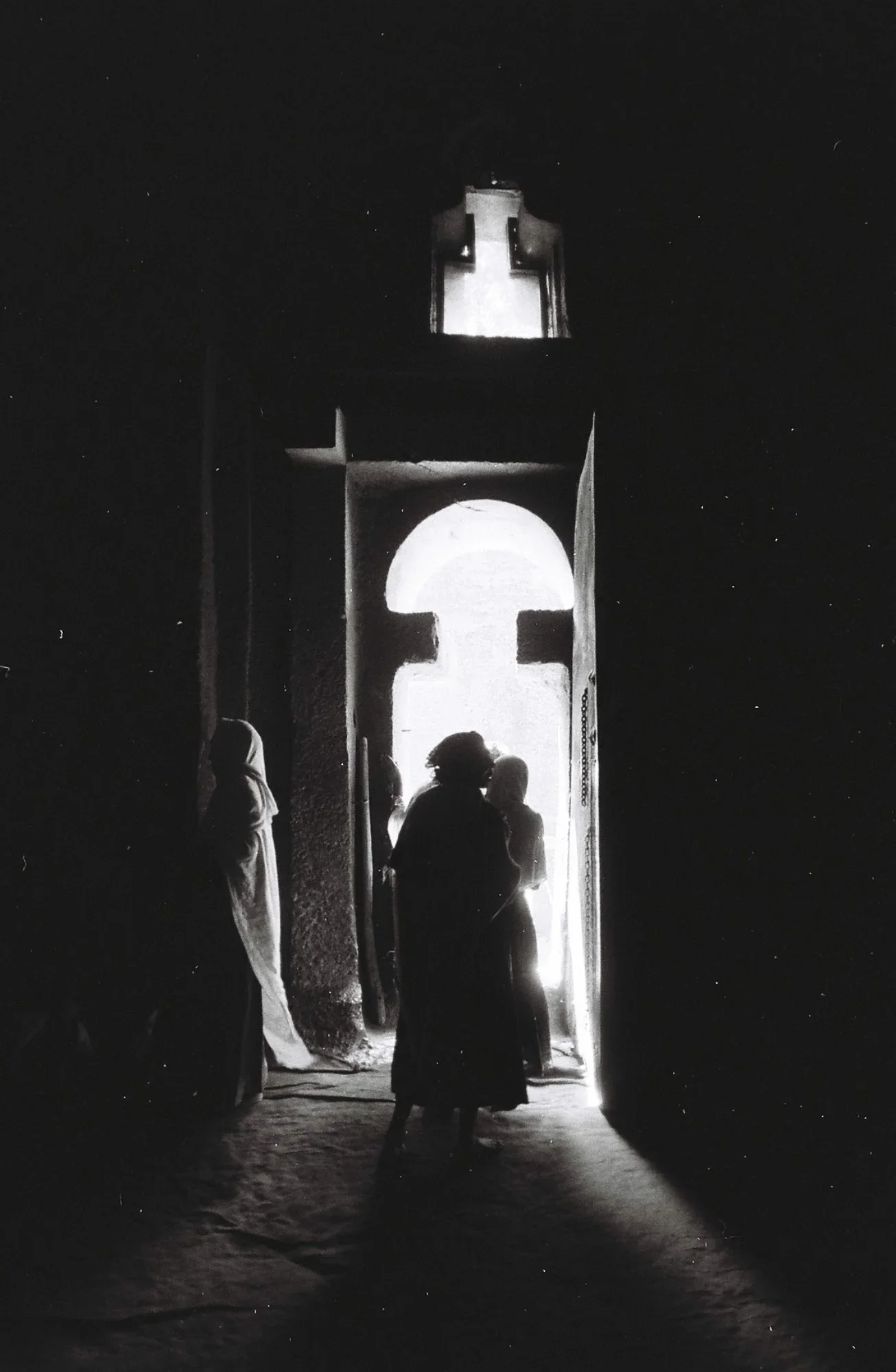 The interiors of these rock-hewn Churches are small and dimly lite. Pilgrims find a spot to sit on the floor to pray or sleep as a steady stream of devotees make offerings.