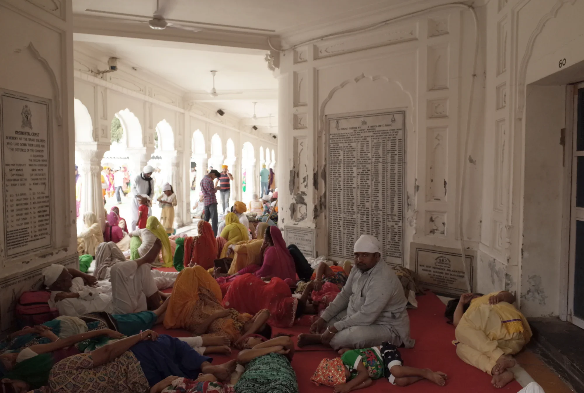 A place to rest, Sikh devotees visiting the Golden Temple nap and relax in the shade.