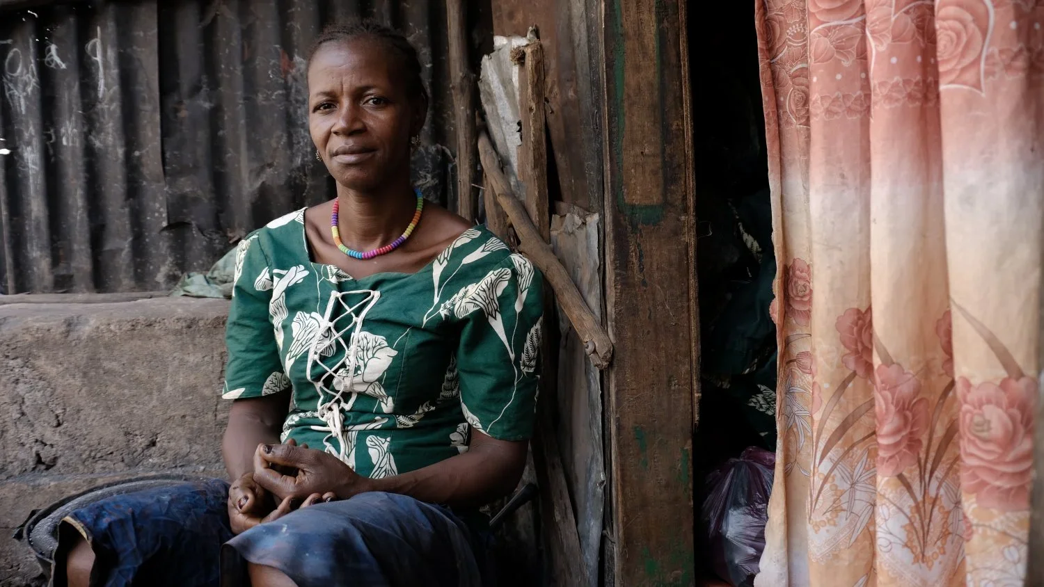 Isatu Kamara. A single mother of four children, Isatu now 50, lost her husband during the last Ebola outbreak and supports her family selling coal. She lives in the community of Kroo Bay a slum in central Freetown. She'd eventually like to move towar