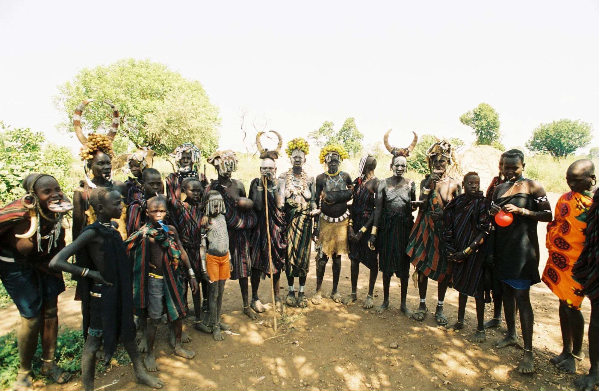 Members of the Mursi tribe stand together for a group portrait. 