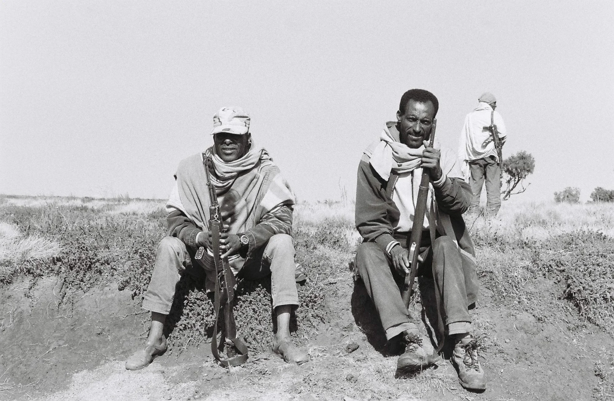 Scouts watch over tourists exploring the Simien Mountains. They are local men who pick up work from tour guides operating out of Debark. They carry Kalishnakov's and sleep on the ground outside tourist tents, often huddle together by a small fire. 