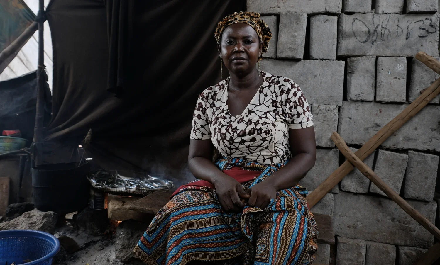 Aminata Conteh lives close to the polluted waterway that flows through the community of Kroo Bay. She earns her living selling thread for fishing which has helped to support her five children after she lost her husband during the last Ebola outbreak.