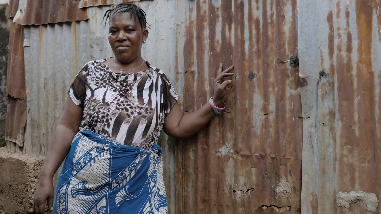 Fatamata Kanu has a fry-fry business in the community of Kroo Bay that sells small fish, potatoes, eggs and sausage. After her husband died from Ebola she became the only income earner for her five children. She's managed to cover school fees and tak