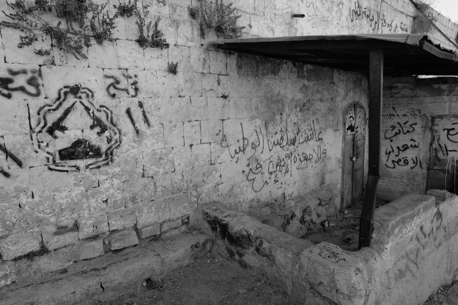 Symbols of resistance are painted throughout the community of Burin. Pictured here is a symbol of Fatah, the largest faction of the Palestinian Liberation Organization (PLO), generally considered to have a strong revolutionary history and ties to Yas