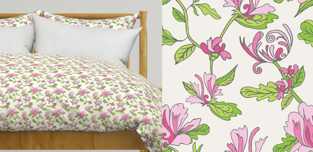 A bedroom with a bed that has floral-patterned bedding featuring pink and green flowers, against a plain wall, with white pillows.
