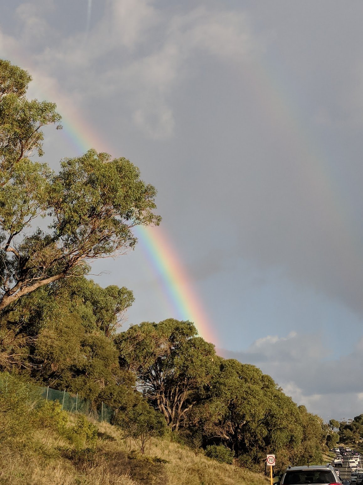 Rainbow over green hills