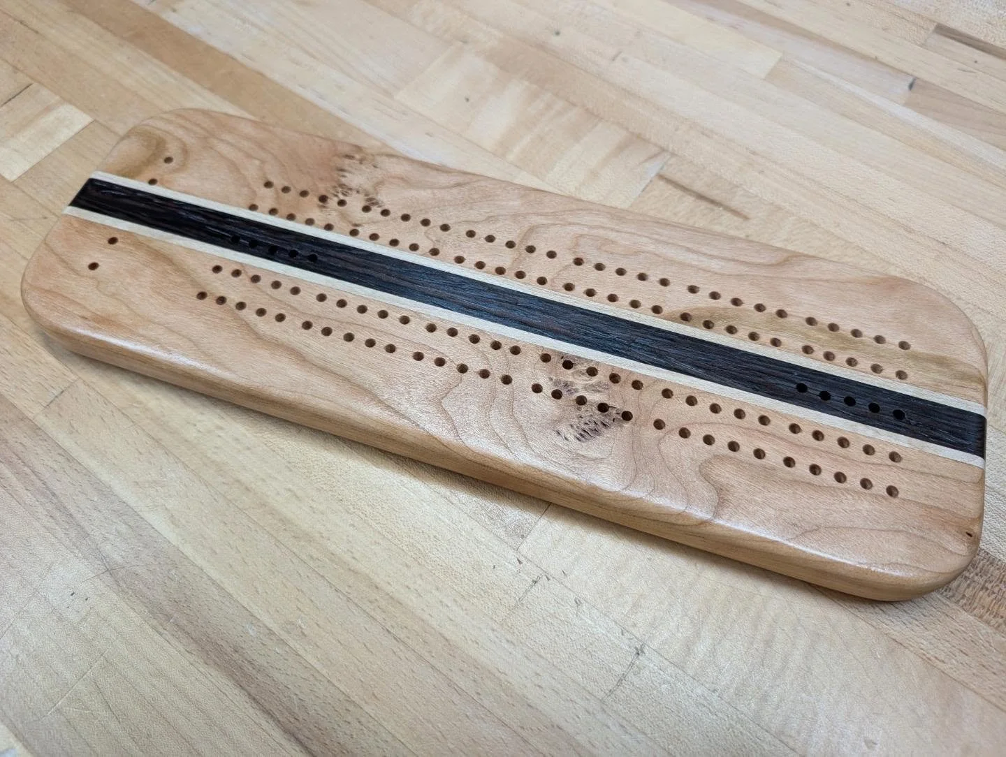 Cribbage Board 🧮🃏
.
Made from Cherry, Wenge, and Maple, with...a lot of holes drilled into it 😵&zwj;💫🕳️🕳️🕳️
.
Finish by @varathane ✨
.
#woodworking #cherry #wenge #maple #custom