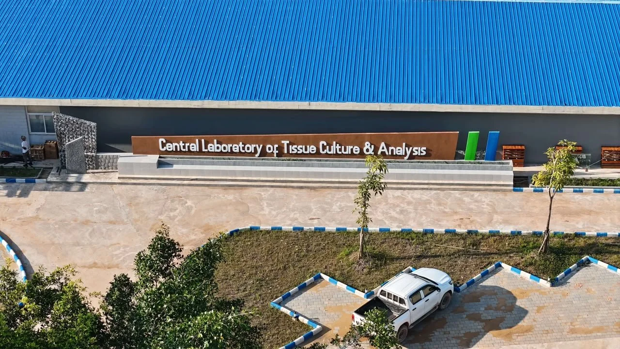 Aerial view of the Central Laboratory of Tissue Culture & Analysis building with a parking lot, small trees, and landscaping.