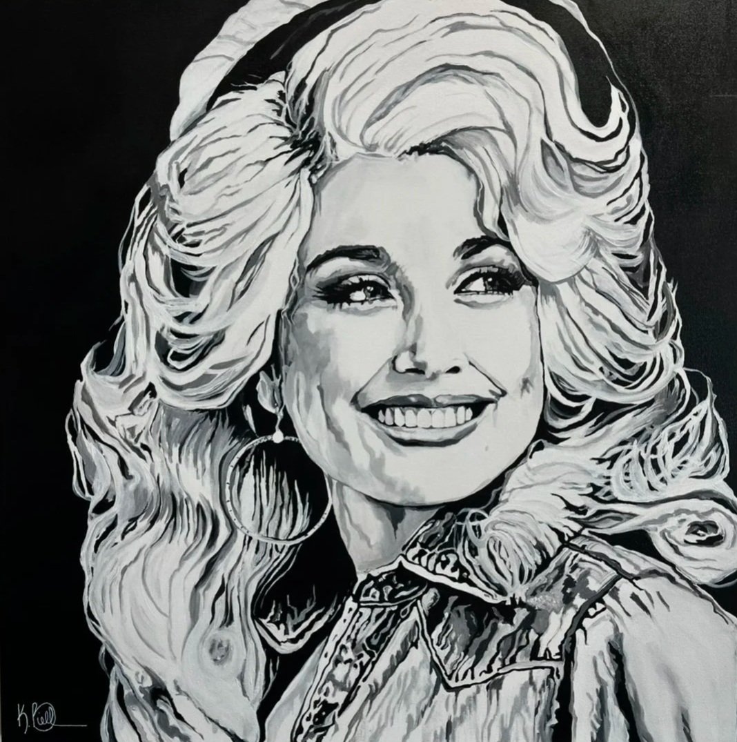 Black and white artistic portrait of a smiling woman with long, wavy hair, hoop earrings, and a collared shirt.