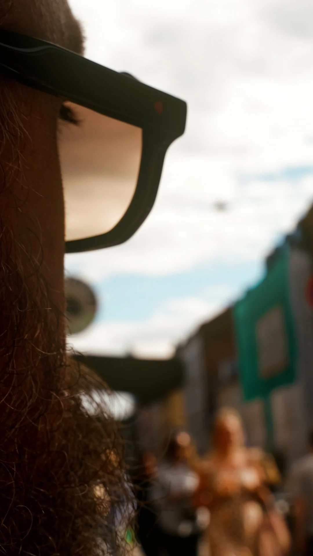 Layered portrait of Per Ove Akselvoll wearing HUG Spectacles DUPREE sunglasses, photographed through glass in Oslo.
