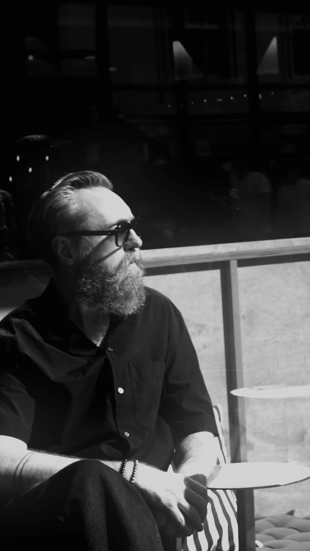 Per Ove Akselvoll wearing HUG Spectacles DUPREE sunglasses in a black-and-white portrait photographed in Oslo.