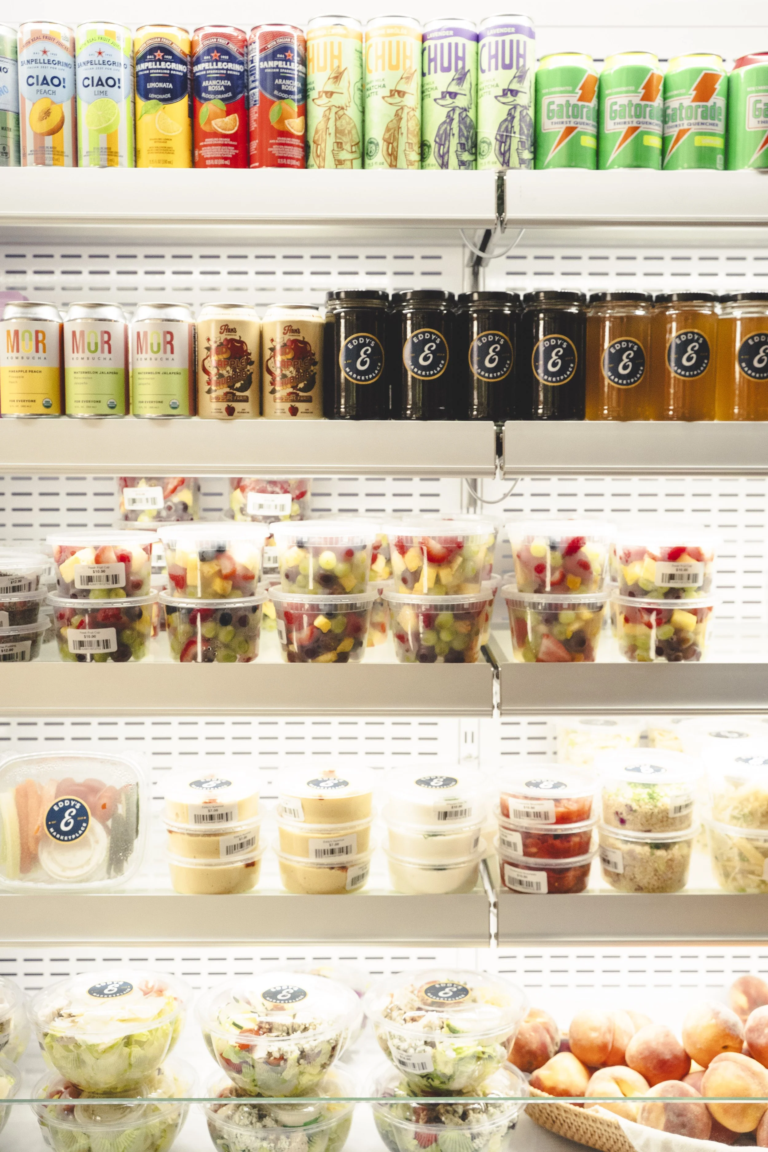 Grab-and-go fridge stocked with fresh housemade meals, snacks, and drinks at Eddy’s Marketplace in Aspen.