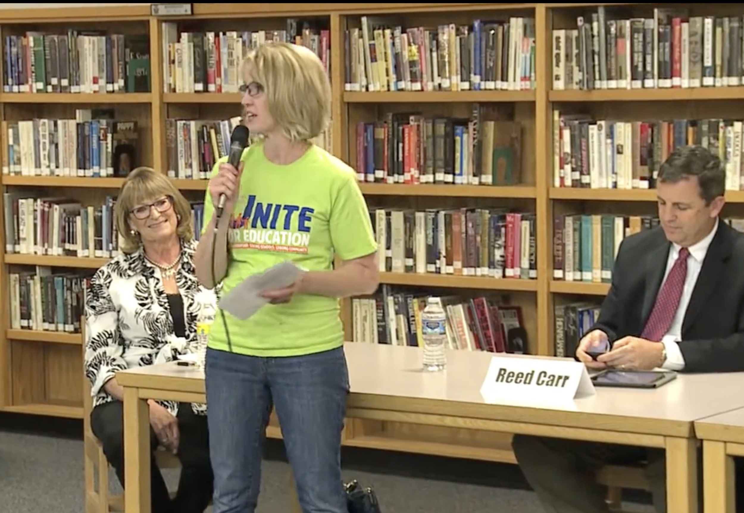 Picture of a Unite for Education volunteer at an event in a school library