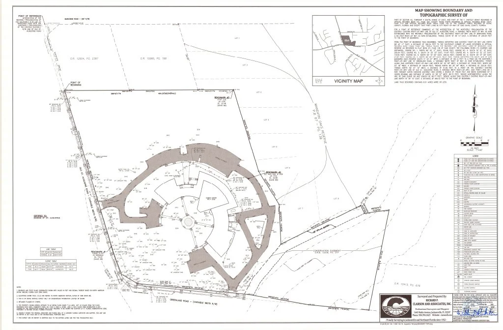 Architectural site plan of a circular building with surrounding landscape and property boundaries, including a vicinity map, topographic survey notes, and a legend. The site is bordered by roads and natural terrain. Created by Clarson and Associates.