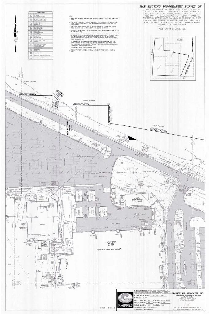 A topographic survey map of land and property boundaries, including buildings such as a school and surrounding features, with notes and legends. Created by Clarson and Associates, Inc.