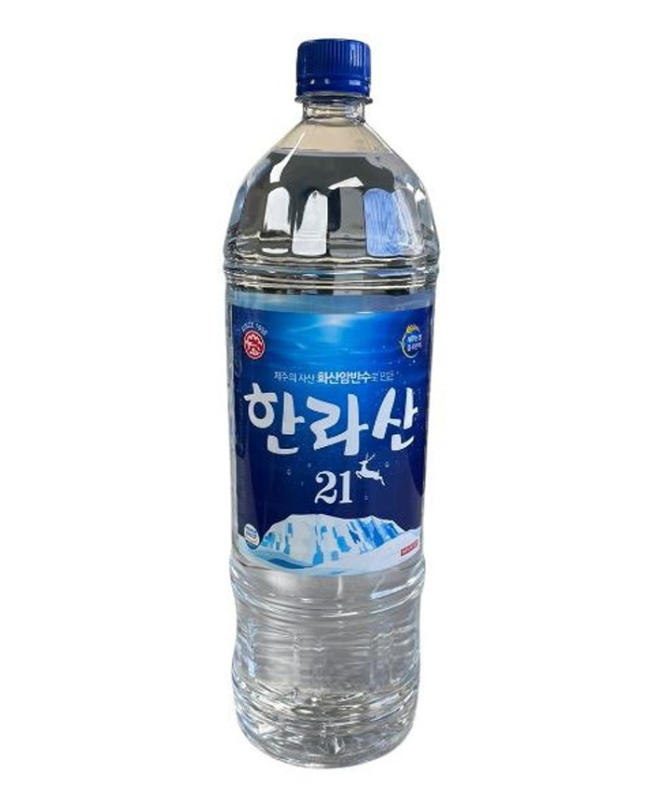 A clear plastic bottle of Korean Hanra Mountain spring water with a blue label and blue cap.
