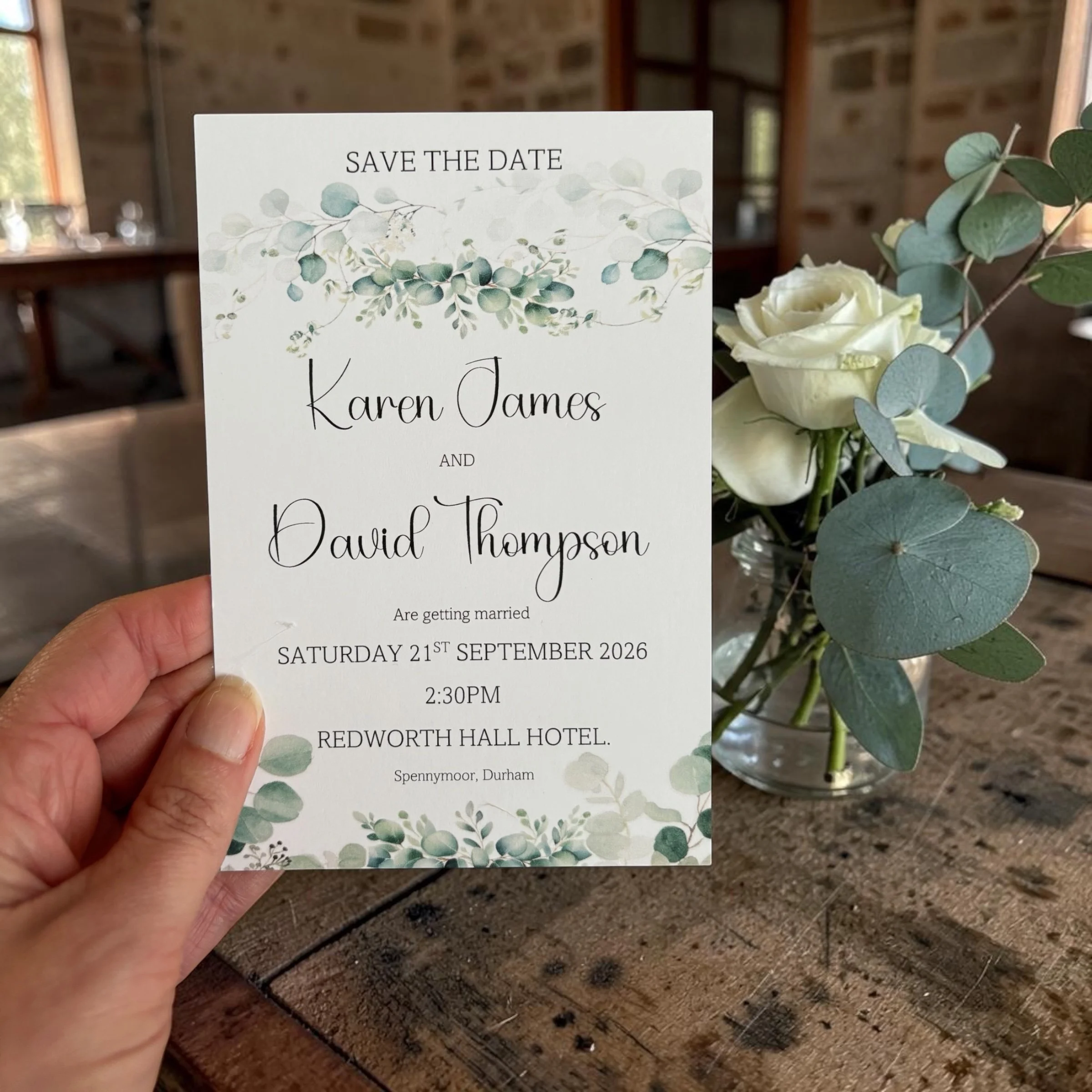 Save the date wedding invitation card with floral design and names Karen James and David Thompson.