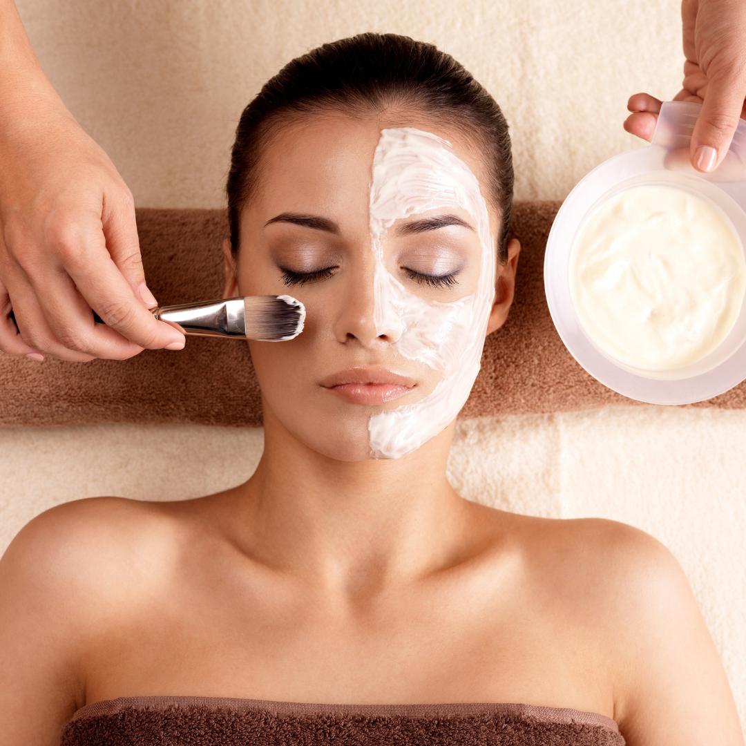 Professional facial treatment in progress with skincare products and relaxing spa environment.