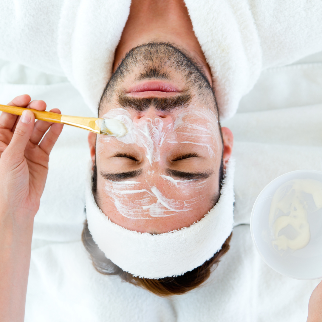 Warm spa setting with candlelight and skincare products promoting winter self-care and relaxation.