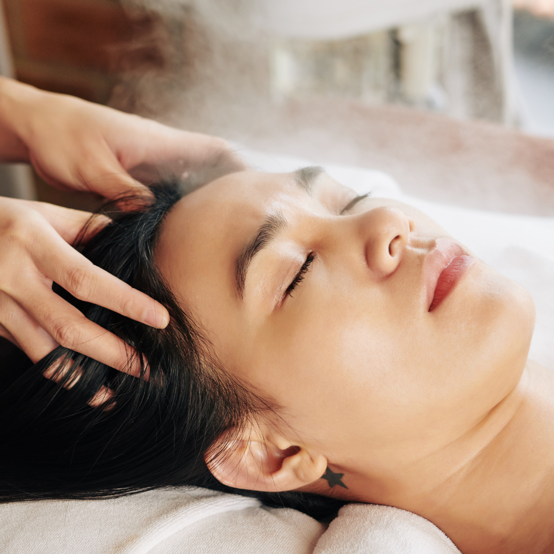 Client receiving a relaxing scalp massage during a spa treatment