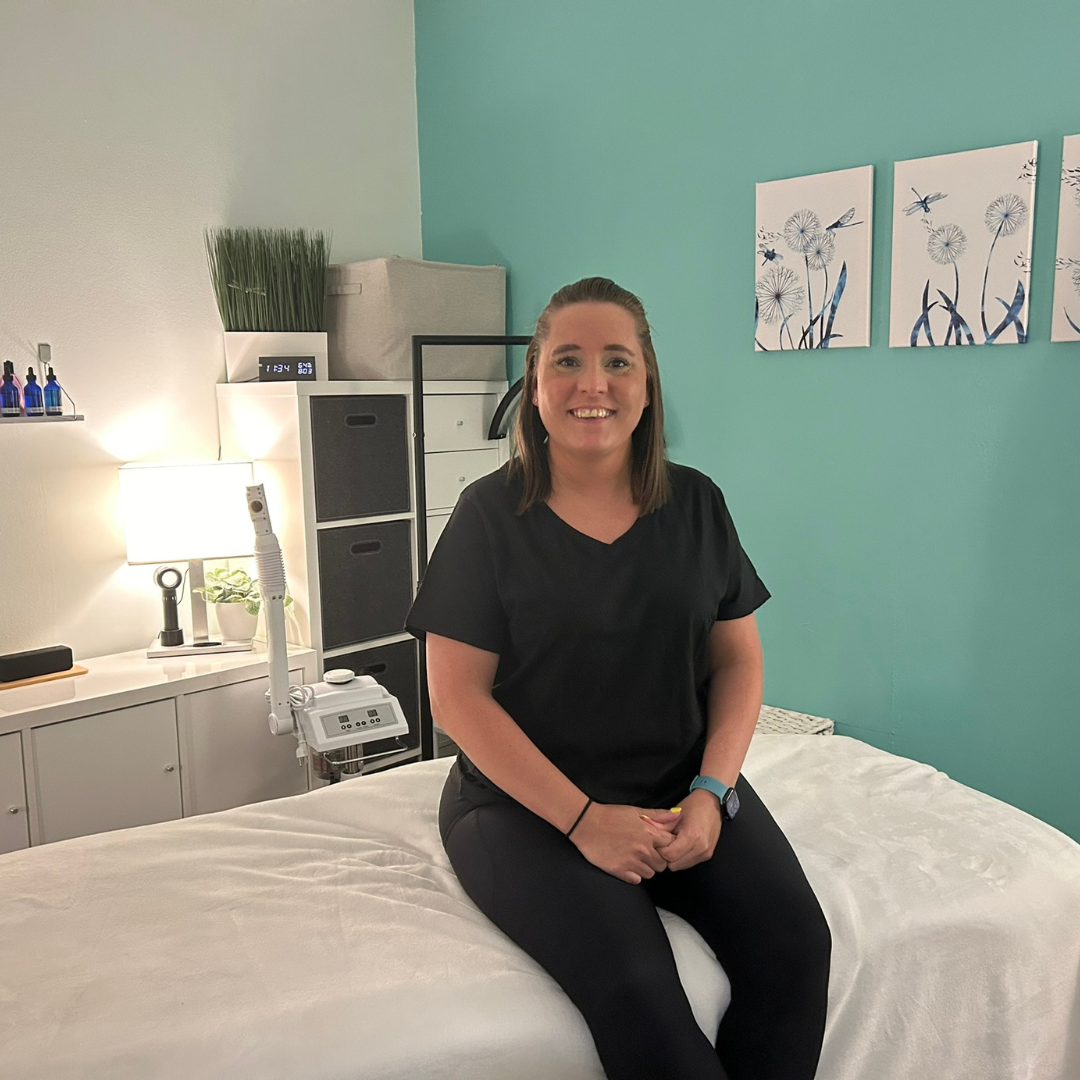 Dana sitting in the DK Spa treatment room as part of a self-care and relaxation blog