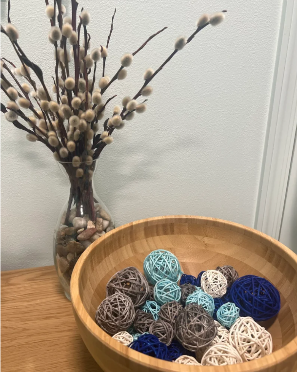 Decorative bowl and pussy willow arrangement welcoming guests at DK Spa in Lynnwood, Washington.
