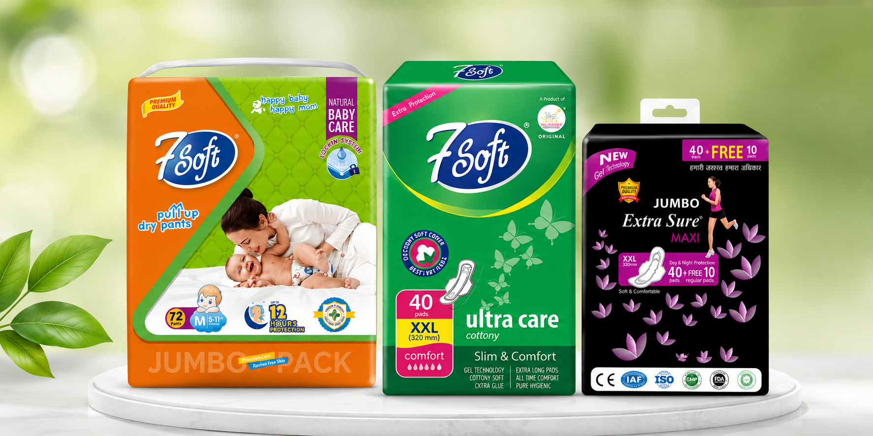 Three packages of baby diapers in green, orange, and black with product details and images, placed on a white platform with green leaves on the side.