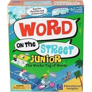 Board game box titled 'Word on the Street Junior' with colorful illustrations including children riding bikes, palm trees, and buildings, designed for educational fun for children