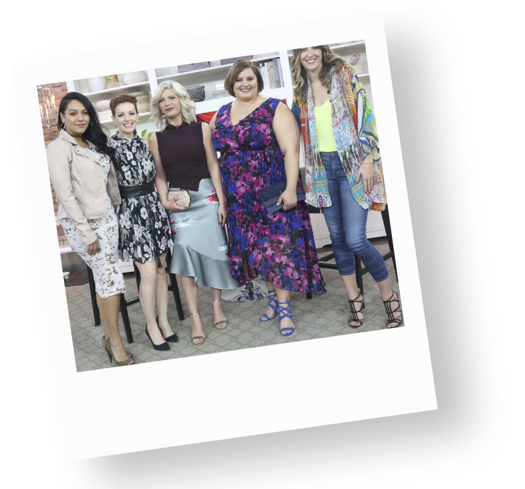 A diverse group of joyful white women, in vibrant floral outfits, stand together in an inviting space filled with creativity, embodying fat liberation and body positivity.