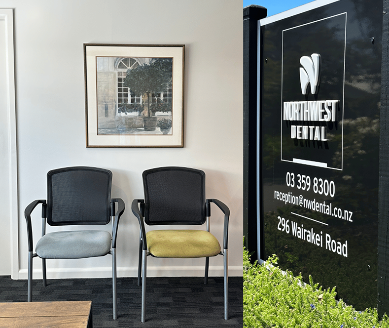 Interior of a dental office waiting area with two black chairs, one with a light gray cushion and the other with a yellow cushion, a framed picture of a building and trees on the wall, and a large black sign with the dental office's name, contact information, and address.