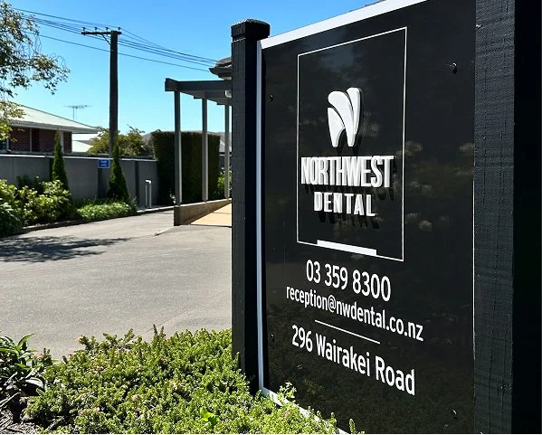 Signboard for Northwest Dental with contact number, email, and address in New Zealand.
