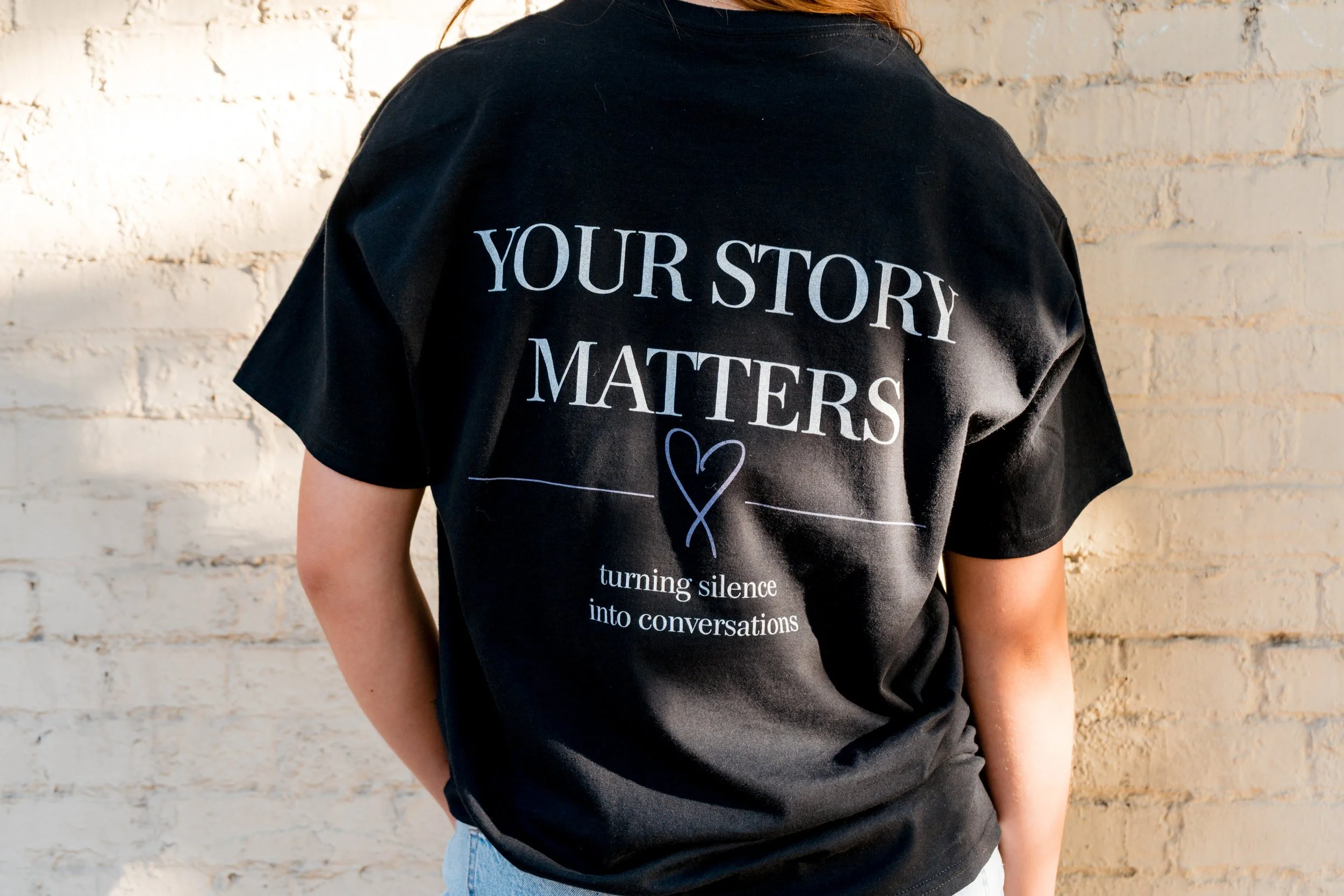 Close-up of a StandUp33 T-shirt displaying the message, "Your Story Matters."