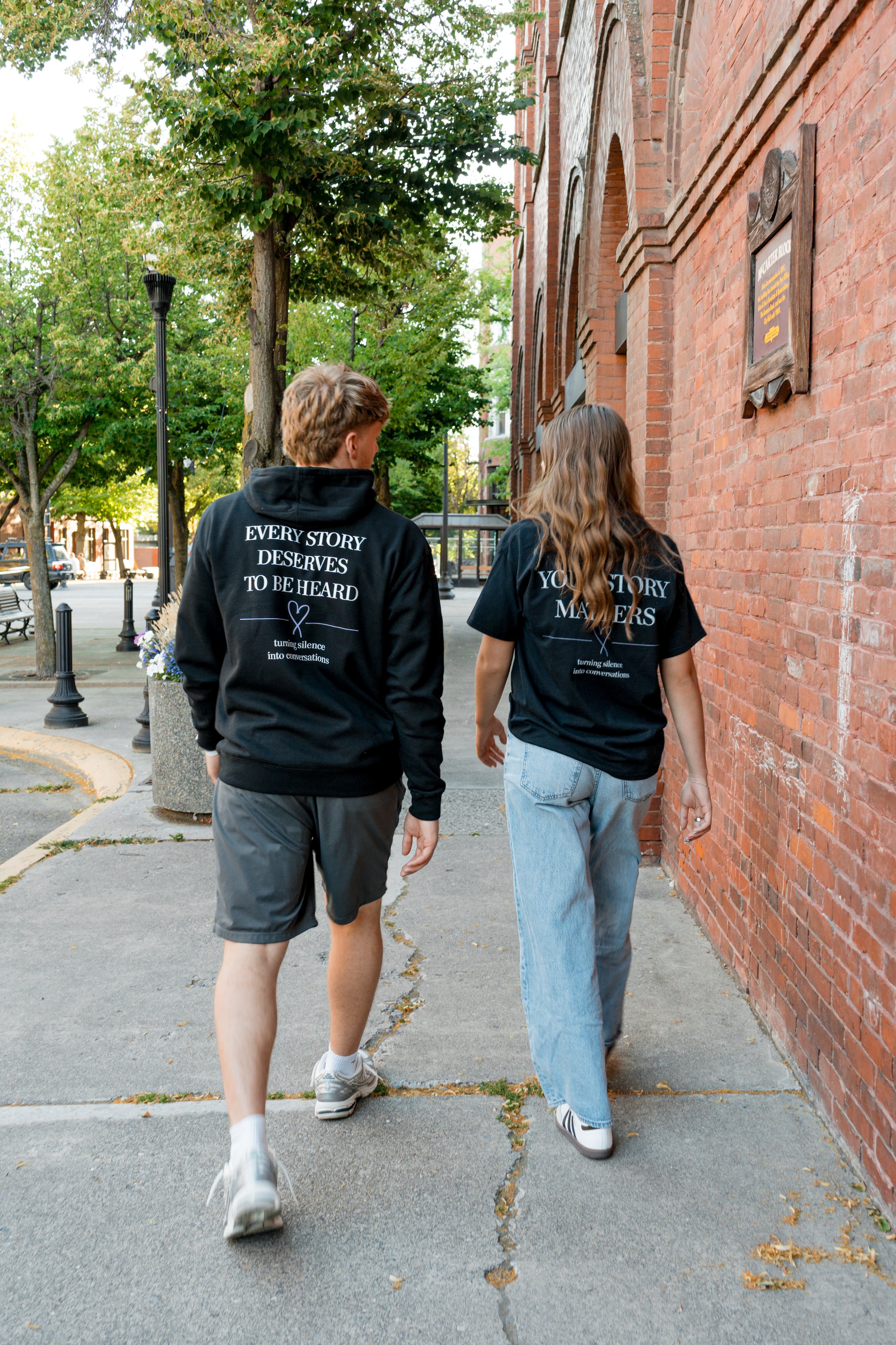 Two people wearing StandUp33 awareness apparel that promotes awareness and encourages meaningful conversations. 
