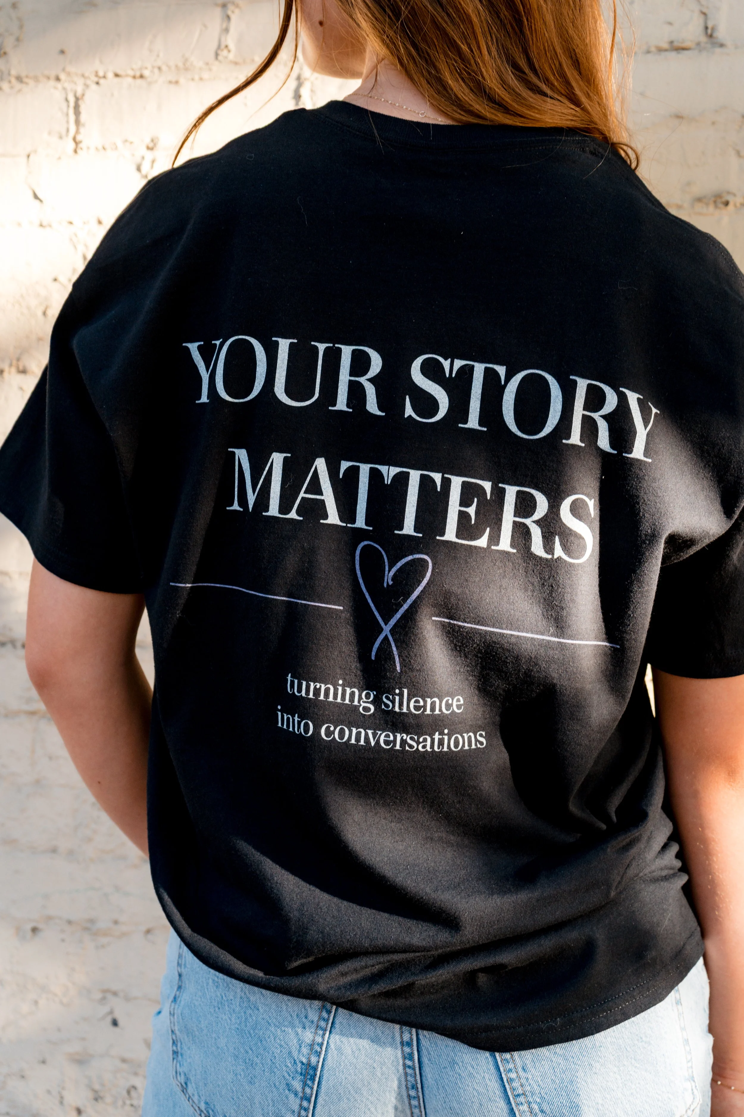 Back of a StandUp33 T-shirt featuring the message, "Your Story Matters."