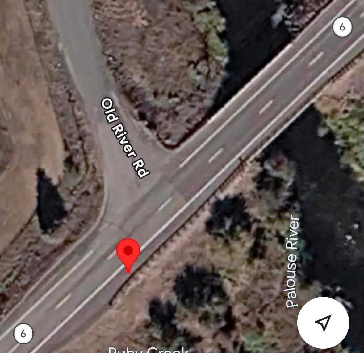 The slippers were found here between the road and guard rail.