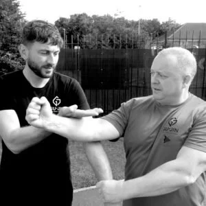 Instructor Alasdair Kirby training with senior student at Gu-Jin Martial Arts.