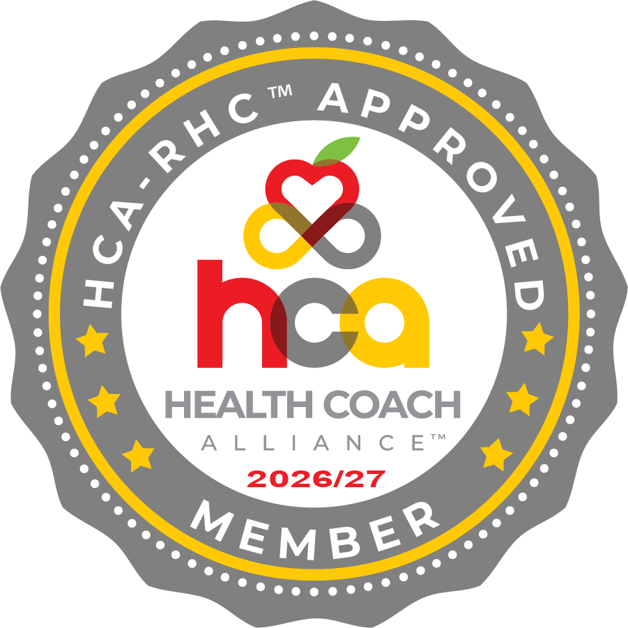 Seal for Health Coach Alliance, 2026/27 member, featuring a stylized apple, heart, and infinity symbol in red, yellow, green, brown, and gray with text around the border.
