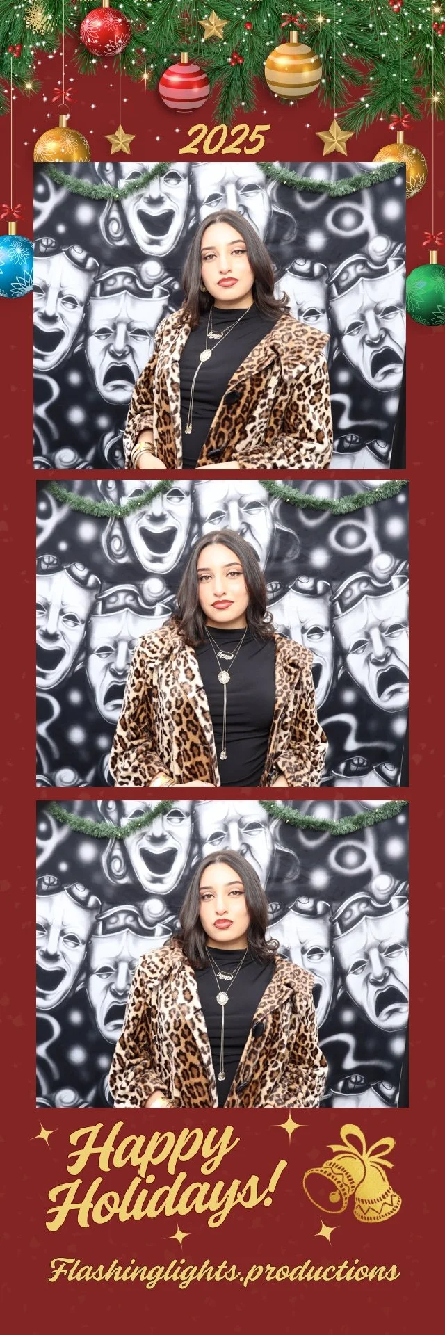 A Christmas-themed photo booth strip features a woman with dark hair in three poses, wearing a leopard print coat over a black top, standing in front of a black and white theatrical masks backdrop decorated with green garland. The top of the strip shows Christmas ornaments and the year 2025. The bottom has a festive message, "Happy Holidays!" and a logo for Flashinglights.productions.