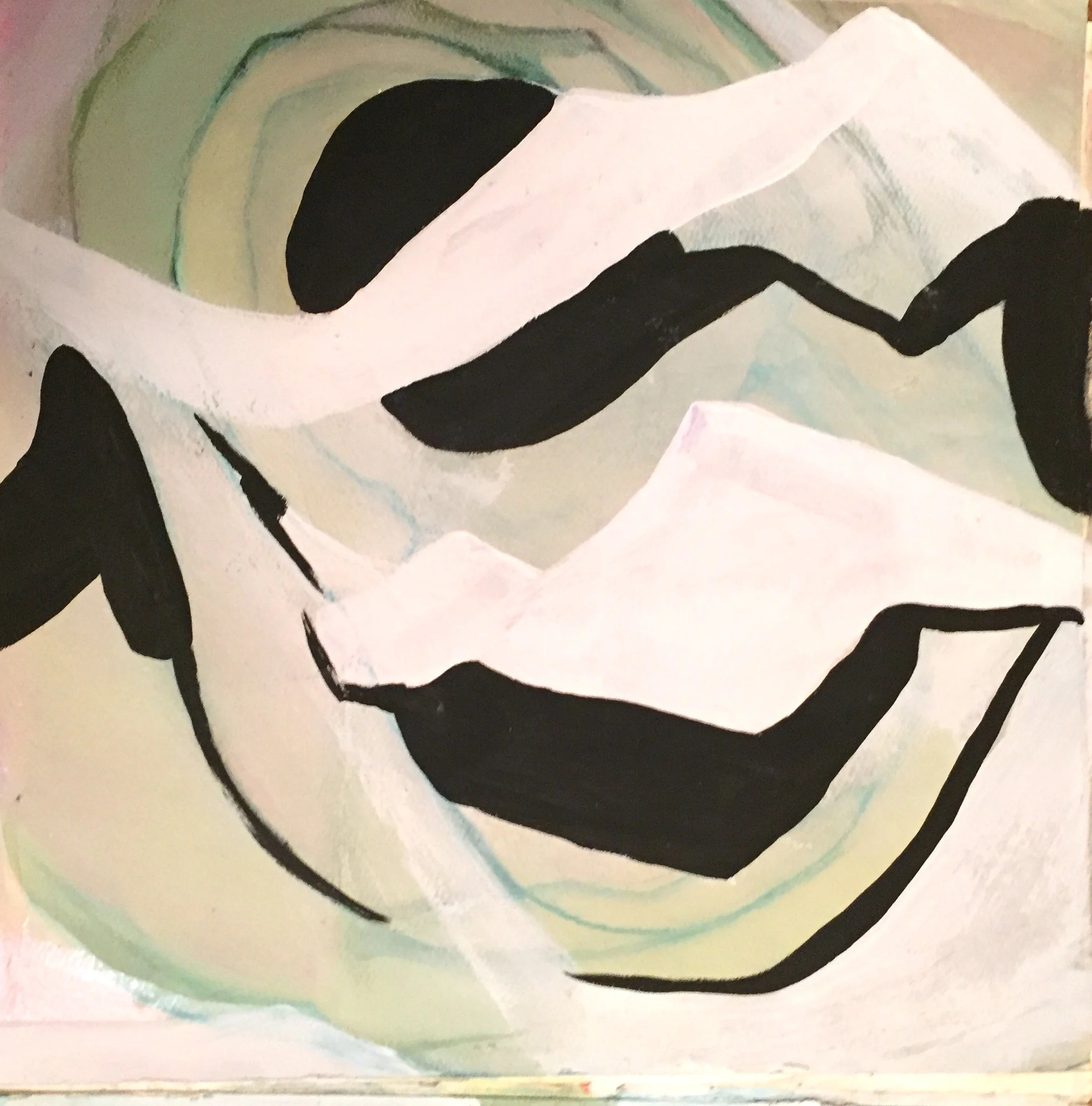 Close-up of an abstract painting featuring black curved lines and colored rings in shades of green, yellow, and pink on a textured surface.
